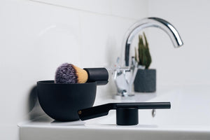 black-shaving-equipment-on-sink